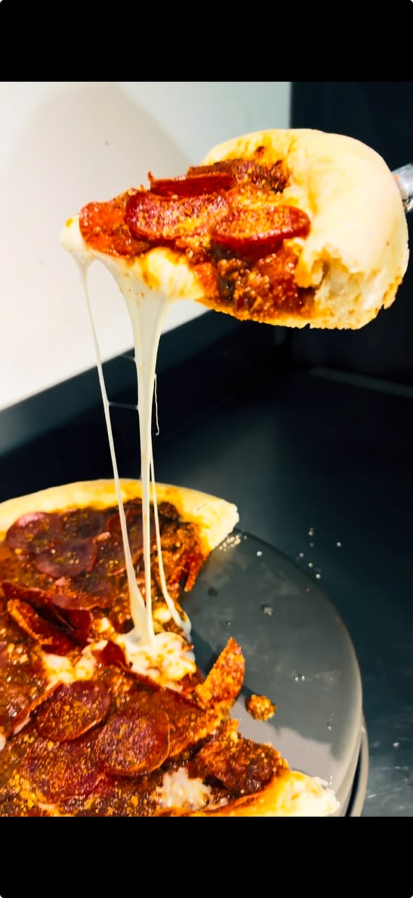 Pizza al centro para compartir